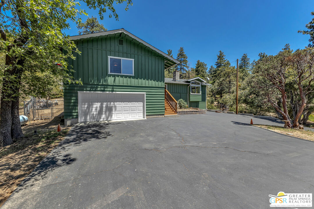 52732 Pine Cove Road Idyllwild, CA 92549 - Photo 56 of 67 a view of a house with a yard and garage