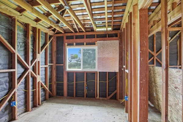 a view of an empty room with wooden walls