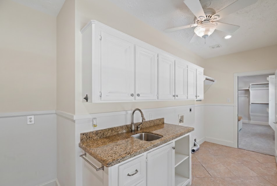 519 Dodge-Oakhurst Road Huntsville, TX 77320 - Photo 11 of 50 a kitchen with a sink and cabinets