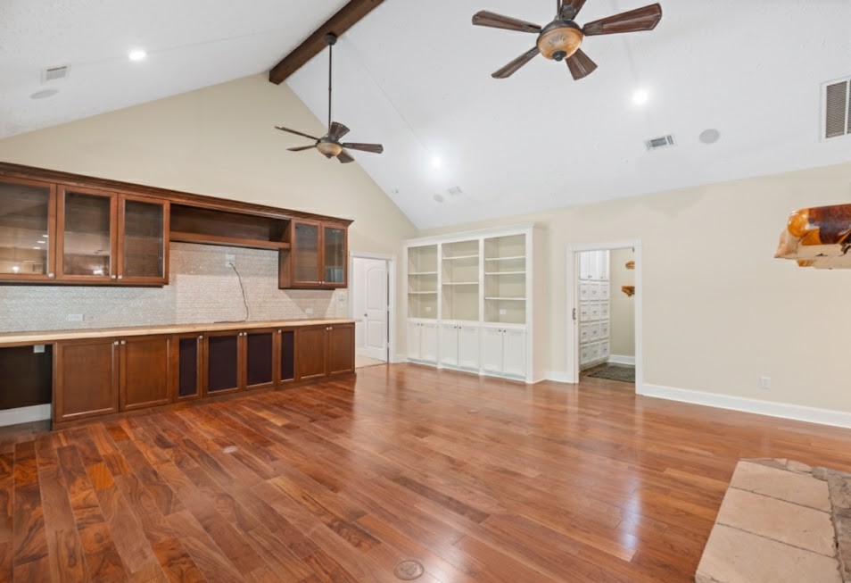 519 Dodge-Oakhurst Road Huntsville, TX 77320 - Photo 18 of 50 a view of an empty room with a window and wooden floor