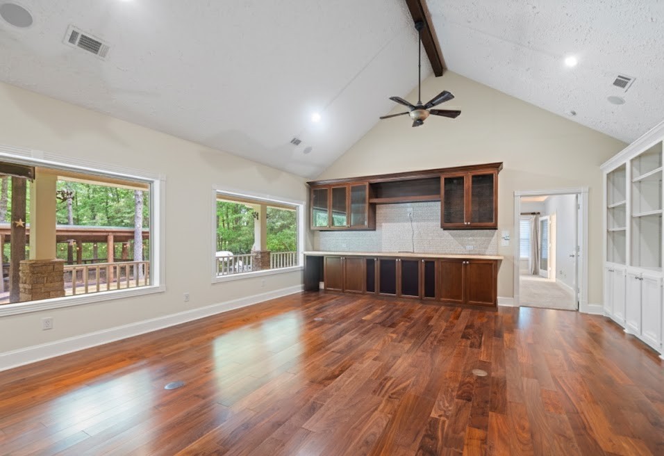519 Dodge-Oakhurst Road Huntsville, TX 77320 - Photo 20 of 50 a view of an empty room with wooden floor and a window
