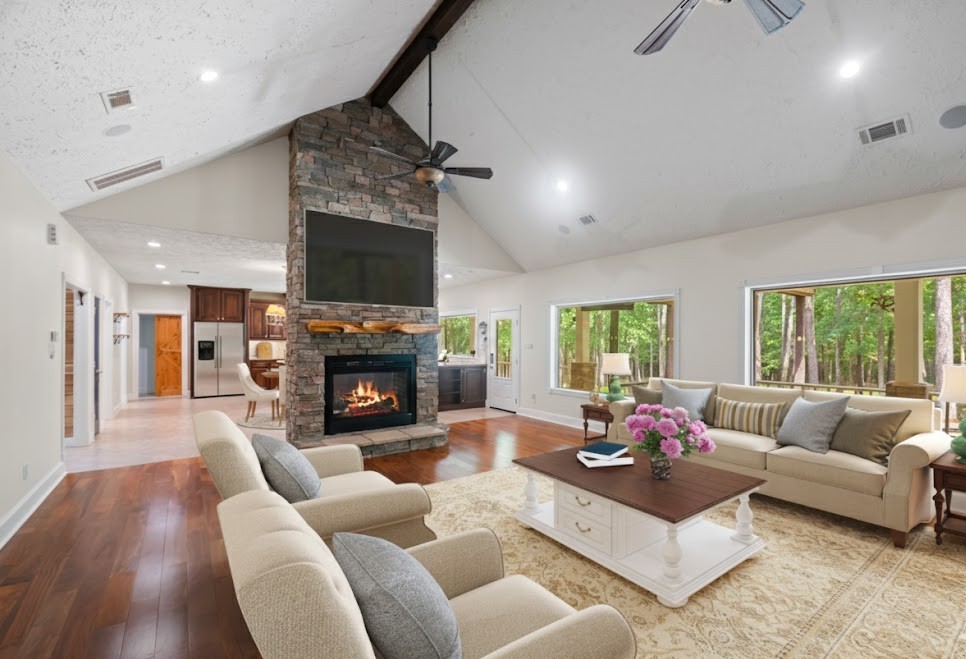 519 Dodge-Oakhurst Road Huntsville, TX 77320 - Photo 21 of 50 a living room with furniture a fireplace and a floor to ceiling window