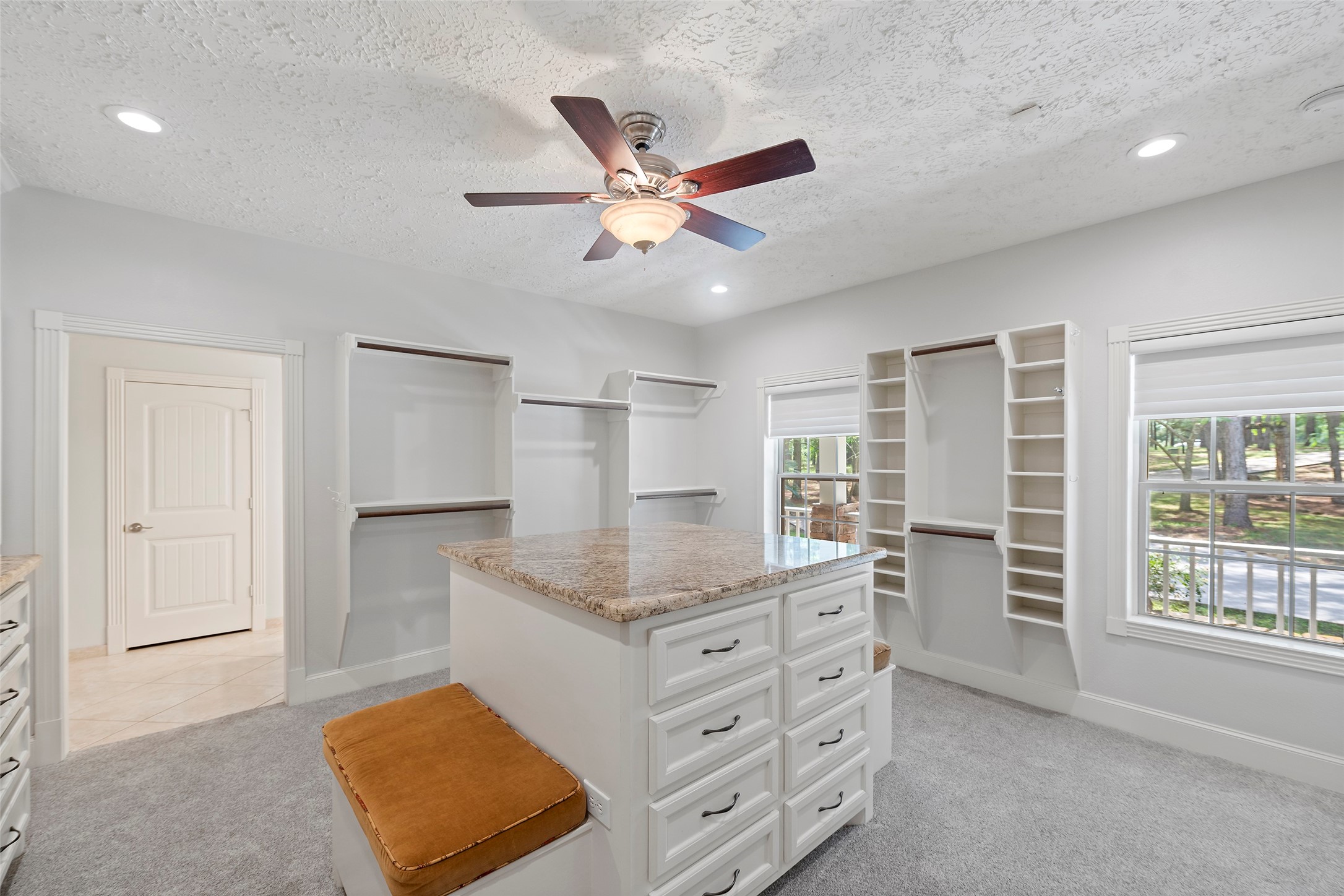 519 Dodge-Oakhurst Road Huntsville, TX 77320 - Photo 26 of 50 a kitchen with kitchen island a counter top space and a ceiling fan