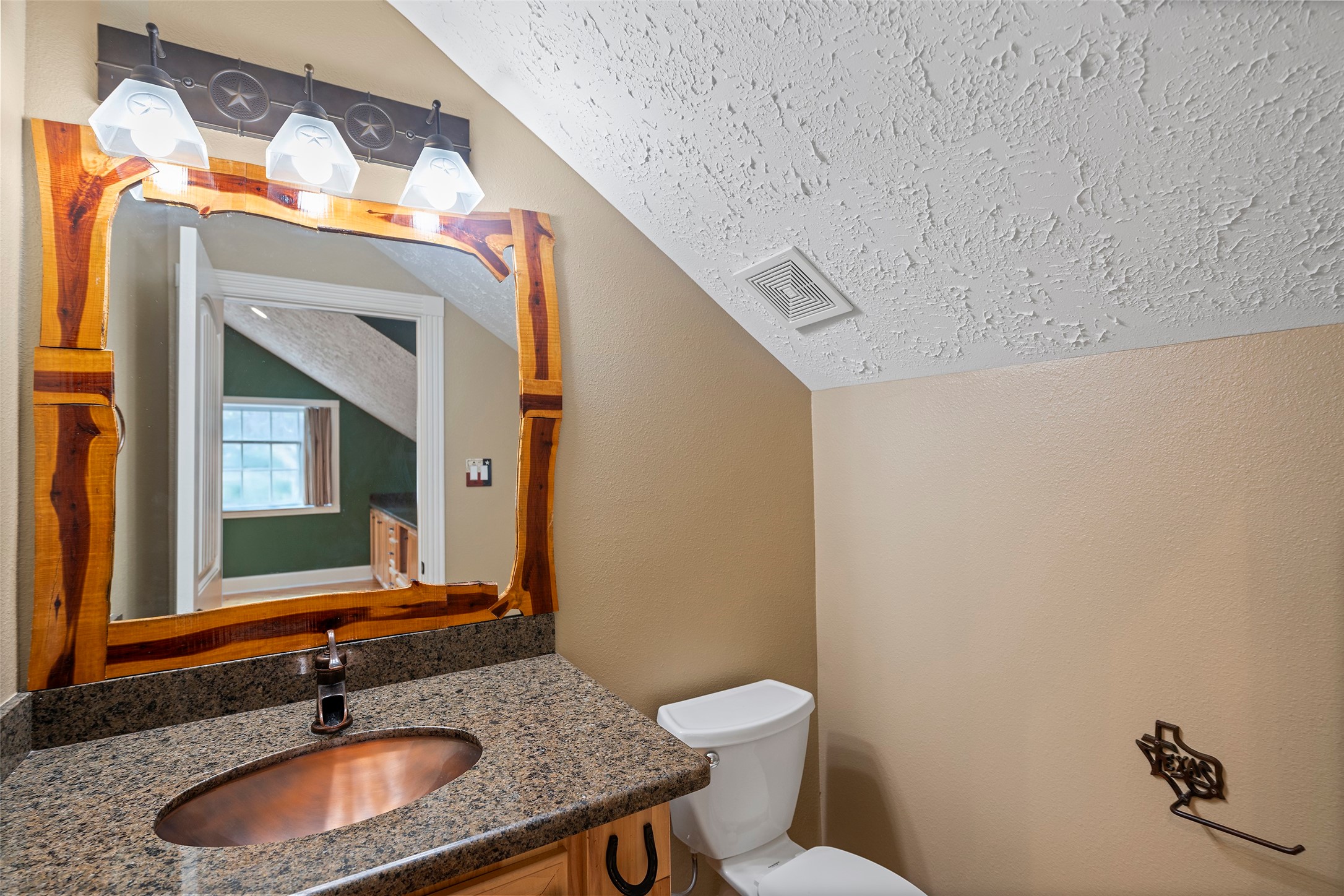 519 Dodge-Oakhurst Road Huntsville, TX 77320 - Photo 33 of 50 a bathroom with a granite countertop sink and a mirror