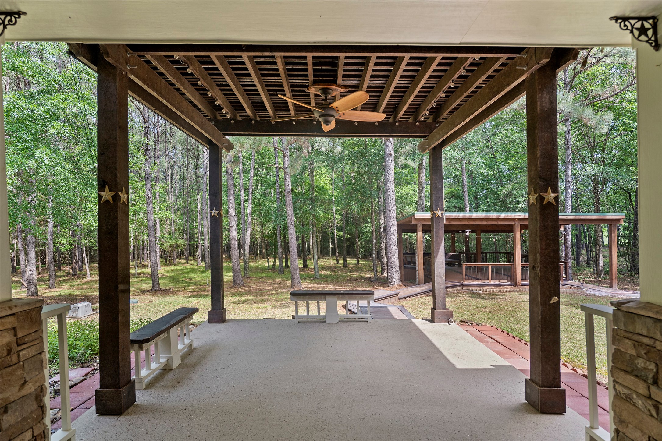 519 Dodge-Oakhurst Road Huntsville, TX 77320 - Photo 40 of 50 a porch with a table and chairs