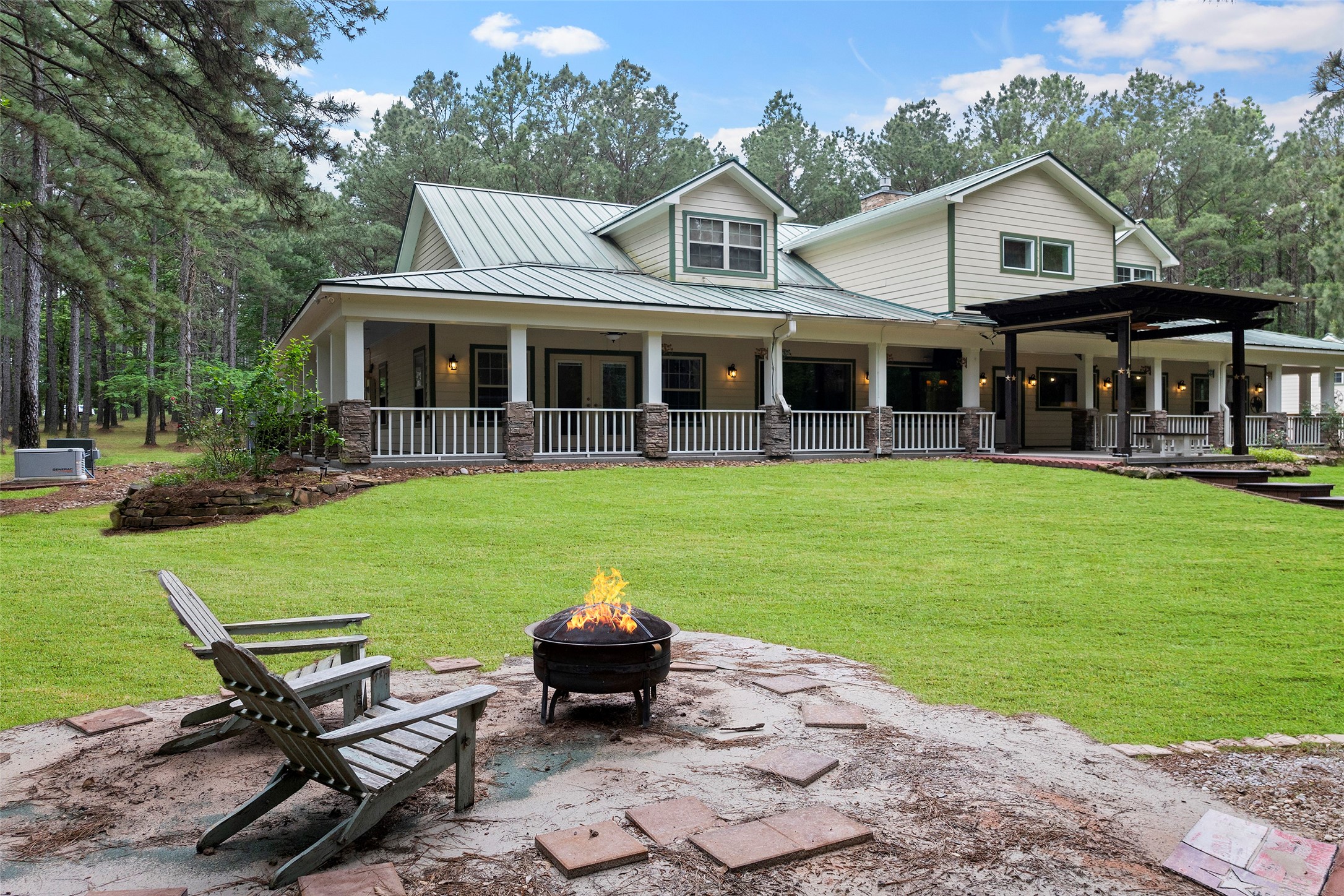 519 Dodge-Oakhurst Road Huntsville, TX 77320 - Photo 43 of 50 a view of a house with a yard deck and sitting area