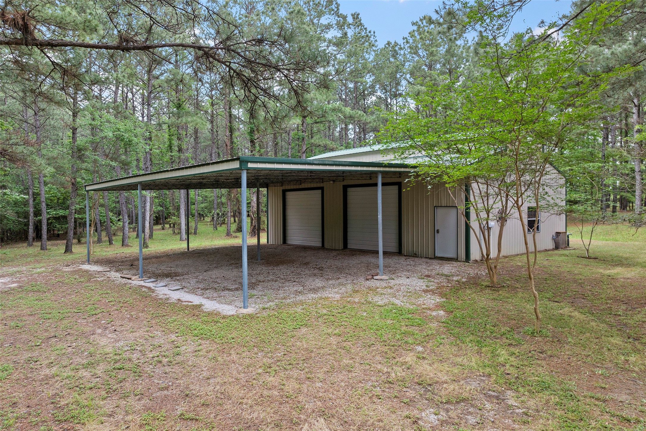 519 Dodge-Oakhurst Road Huntsville, TX 77320 - Photo 46 of 50 a house view with a backyard space