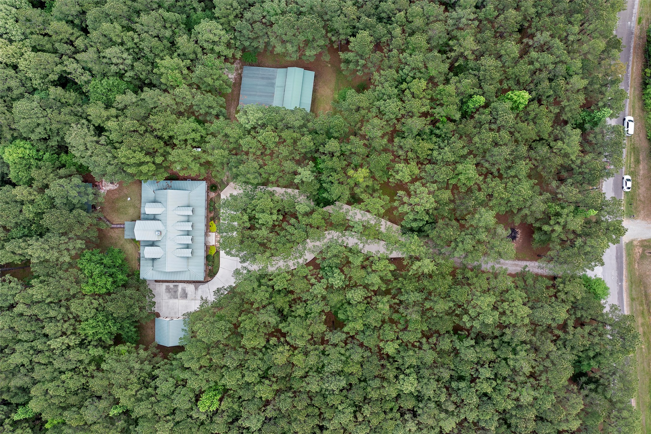 519 Dodge-Oakhurst Road Huntsville, TX 77320 - Photo 8 of 50 an aerial view of a house with a yard