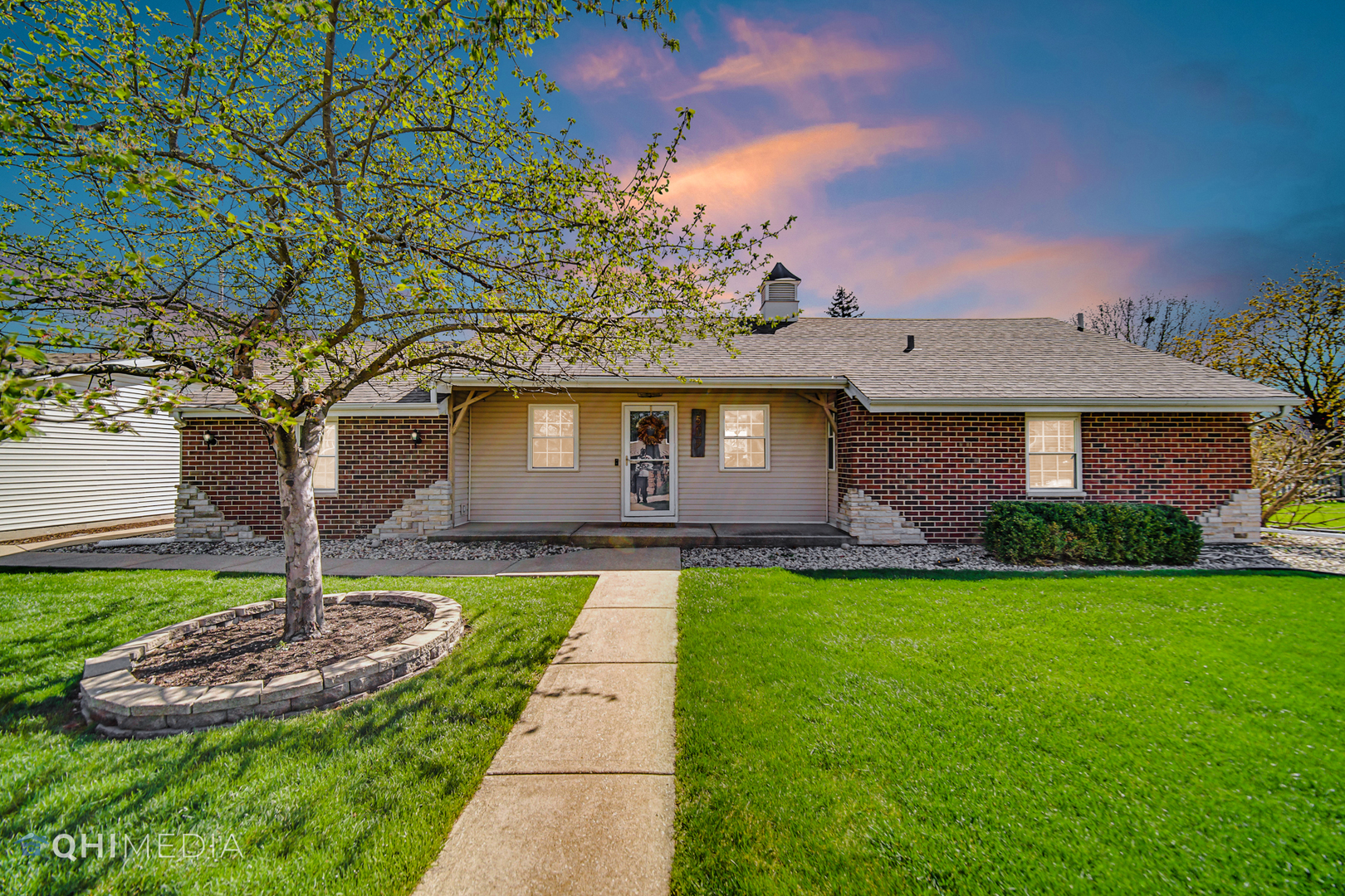 a front view of a house with garden