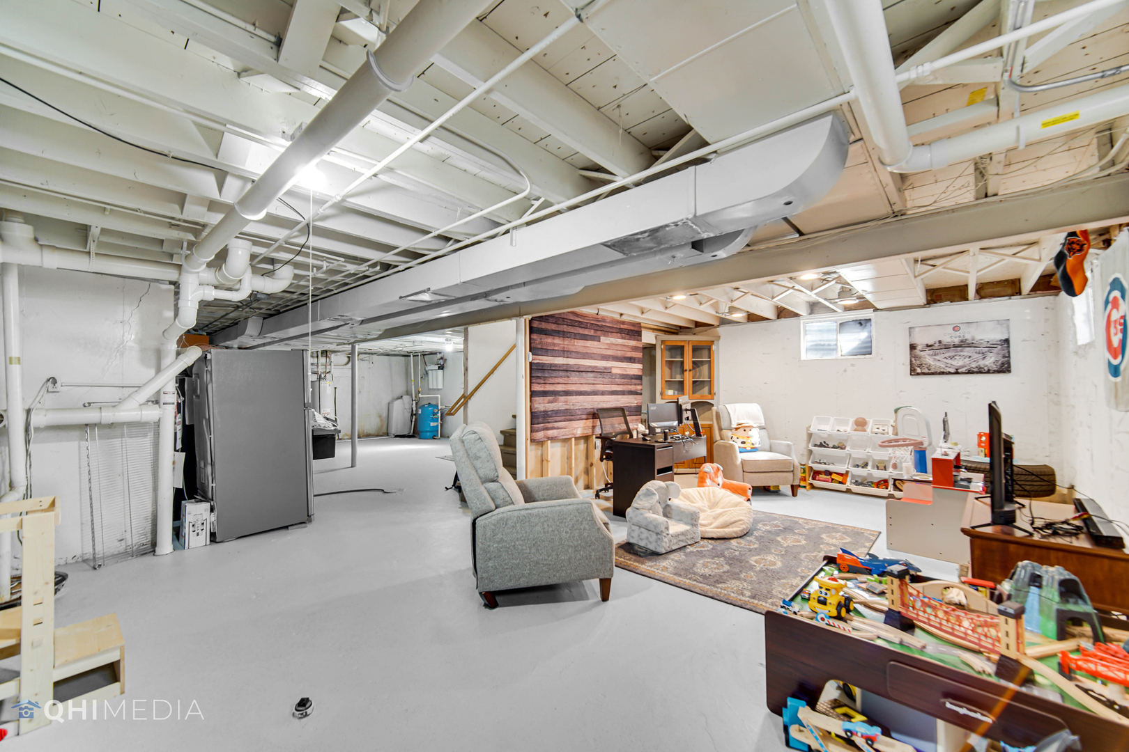 509 4th Street Lemont, IL 60439 - Photo 20 of 34 a living room with lots of furniture and a kitchen view
