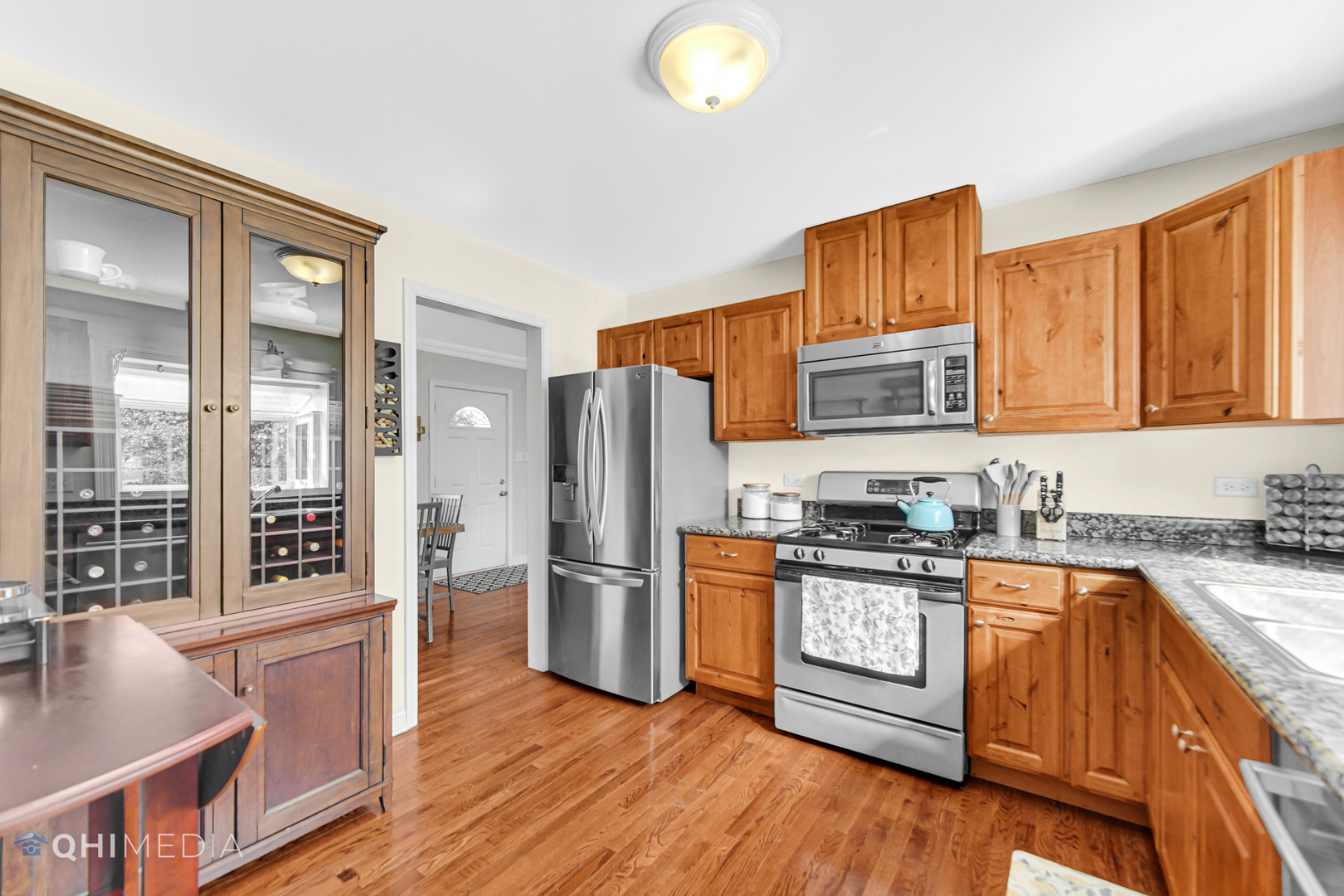 509 4th Street Lemont, IL 60439 - Photo 10 of 34 a kitchen with stainless steel appliances granite countertop a refrigerator stove top oven and sink