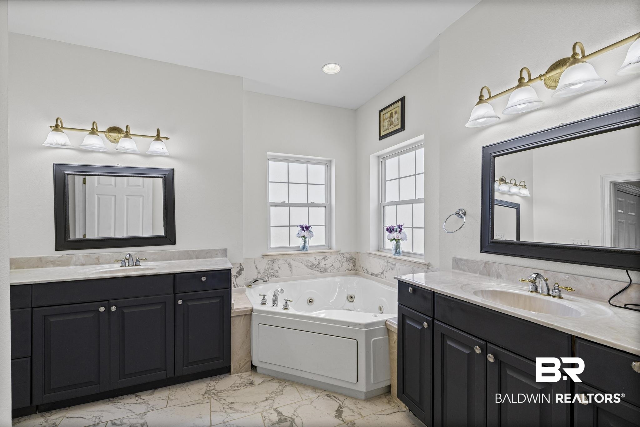 32875 Faircloth Road Lillian, AL 36549 - Photo 37 of 85 Bathroom with a whirlpool tub, two vanities, and light marble finish flooring