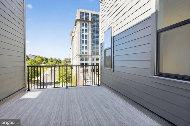 a view of balcony with wooden floor