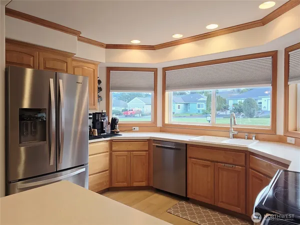a kitchen with a sink stove and refrigerator