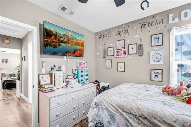 a bedroom with a bed and dresser