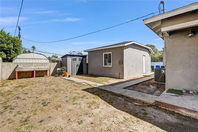 a view of a patio with couches and potted plants