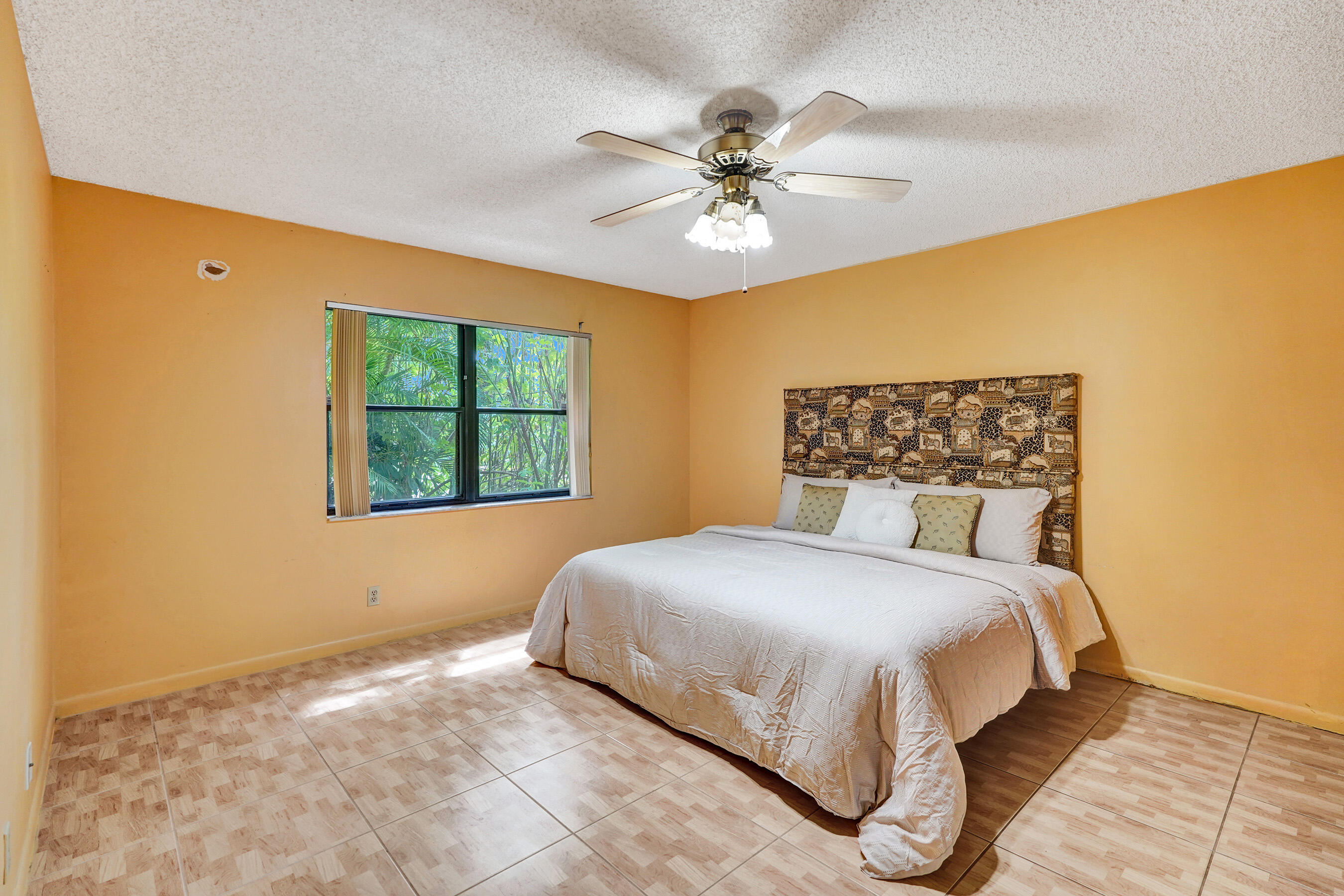 2500 Northwest 10th Street Delray Beach, FL 33445 - Photo 21 of 63 a bedroom with a bed and a window