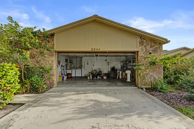 a living room with lots of furniture and white walls