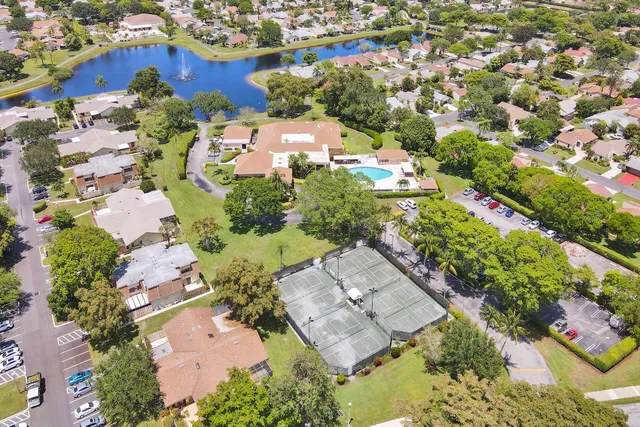 a living room with furniture and a ceiling fan