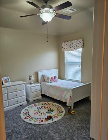 a bed room with furniture and a chandelier