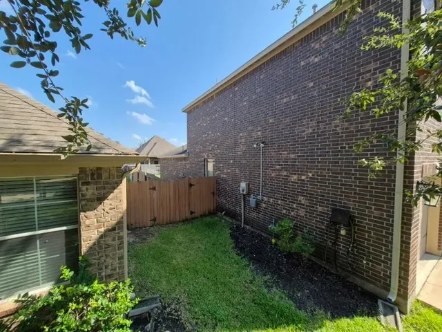 a view of a pathway both side of house