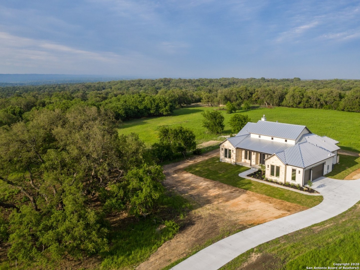 an aerial view of a house with a garden