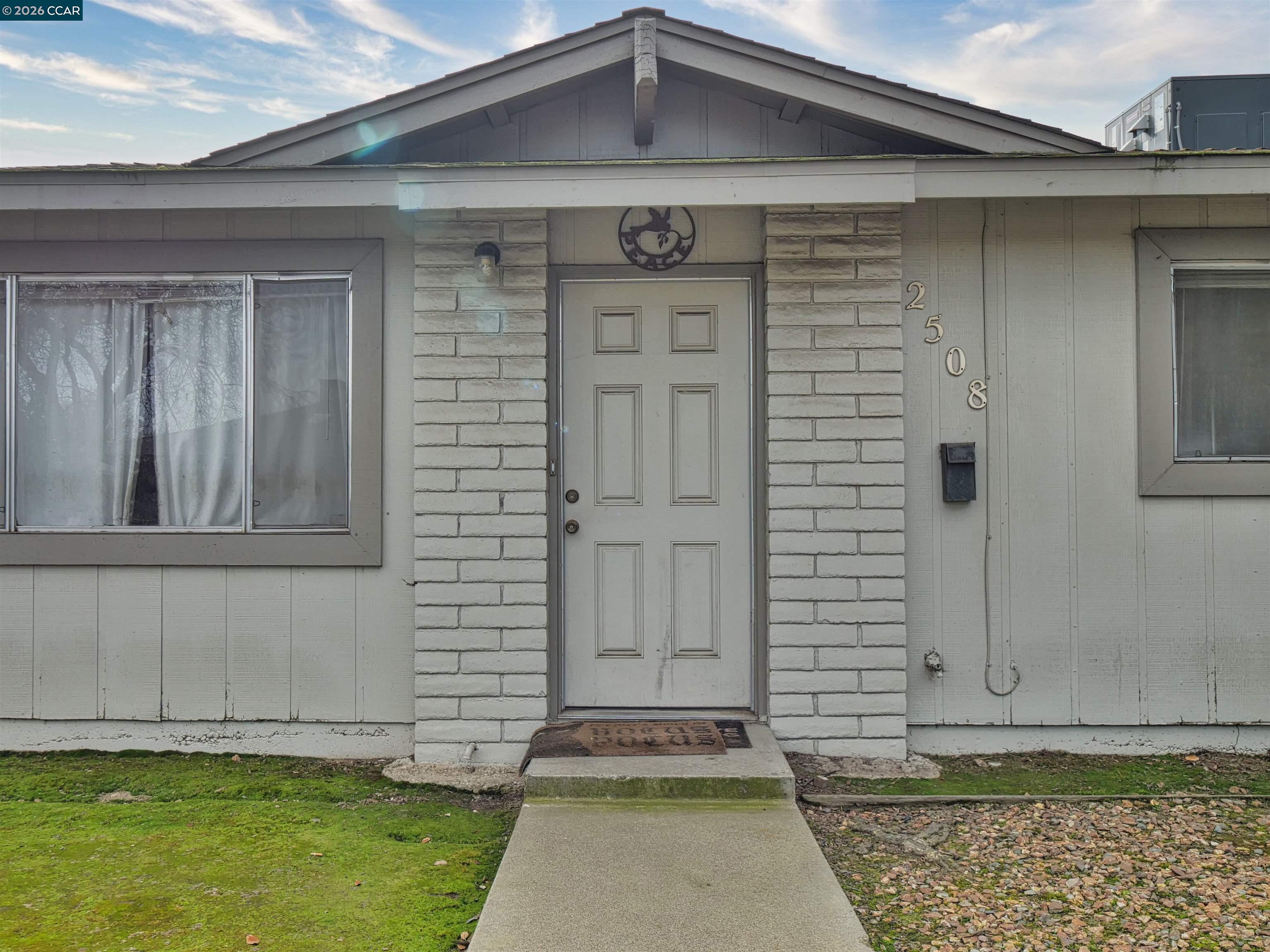 2508 Haddon Avenue Modesto, CA 95354 - Photo 3 of 20 a front view of a house with garden
