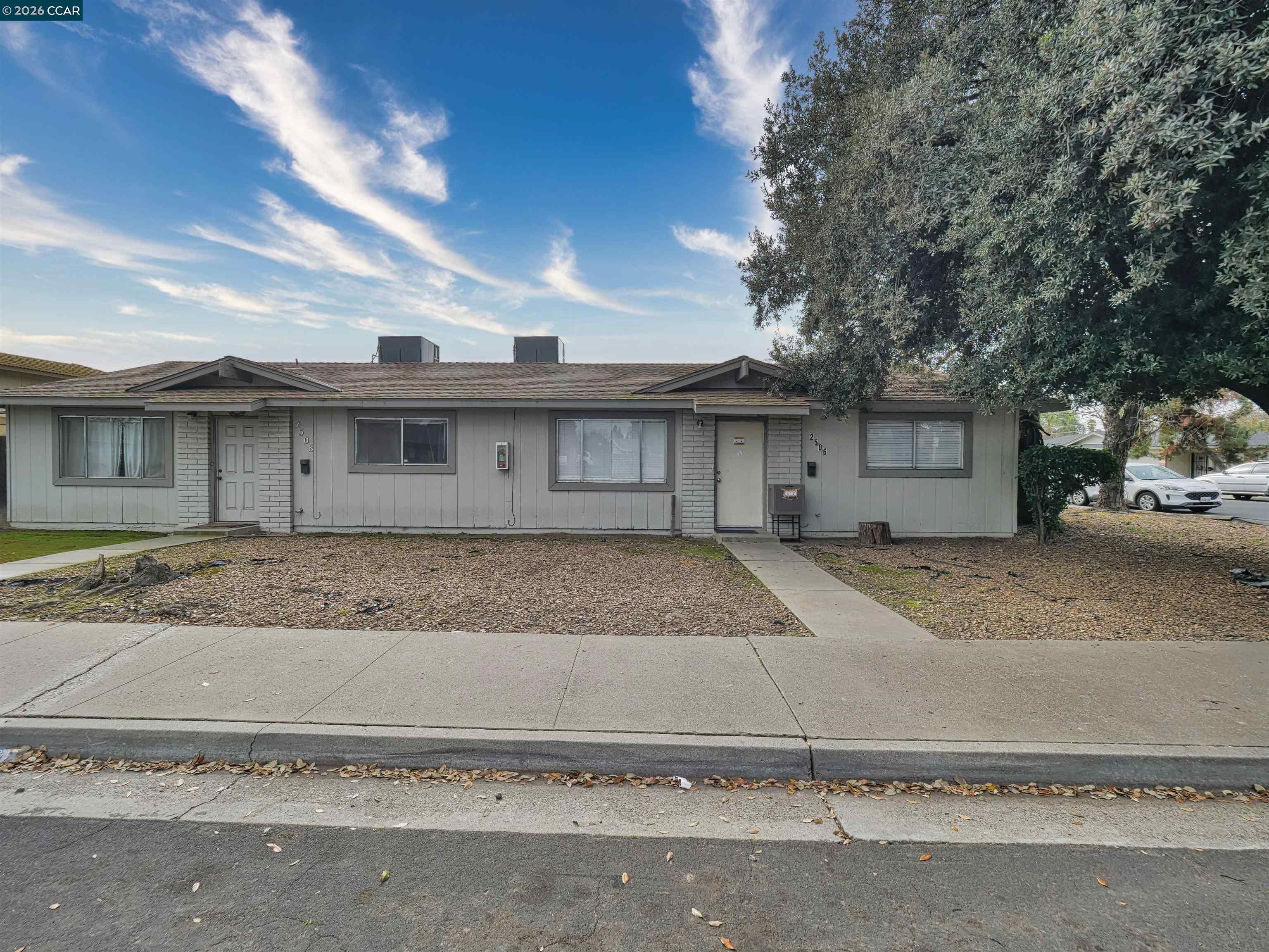 2508 Haddon Avenue Modesto, CA 95354 - Photo 7 of 20 a view of a house with a yard