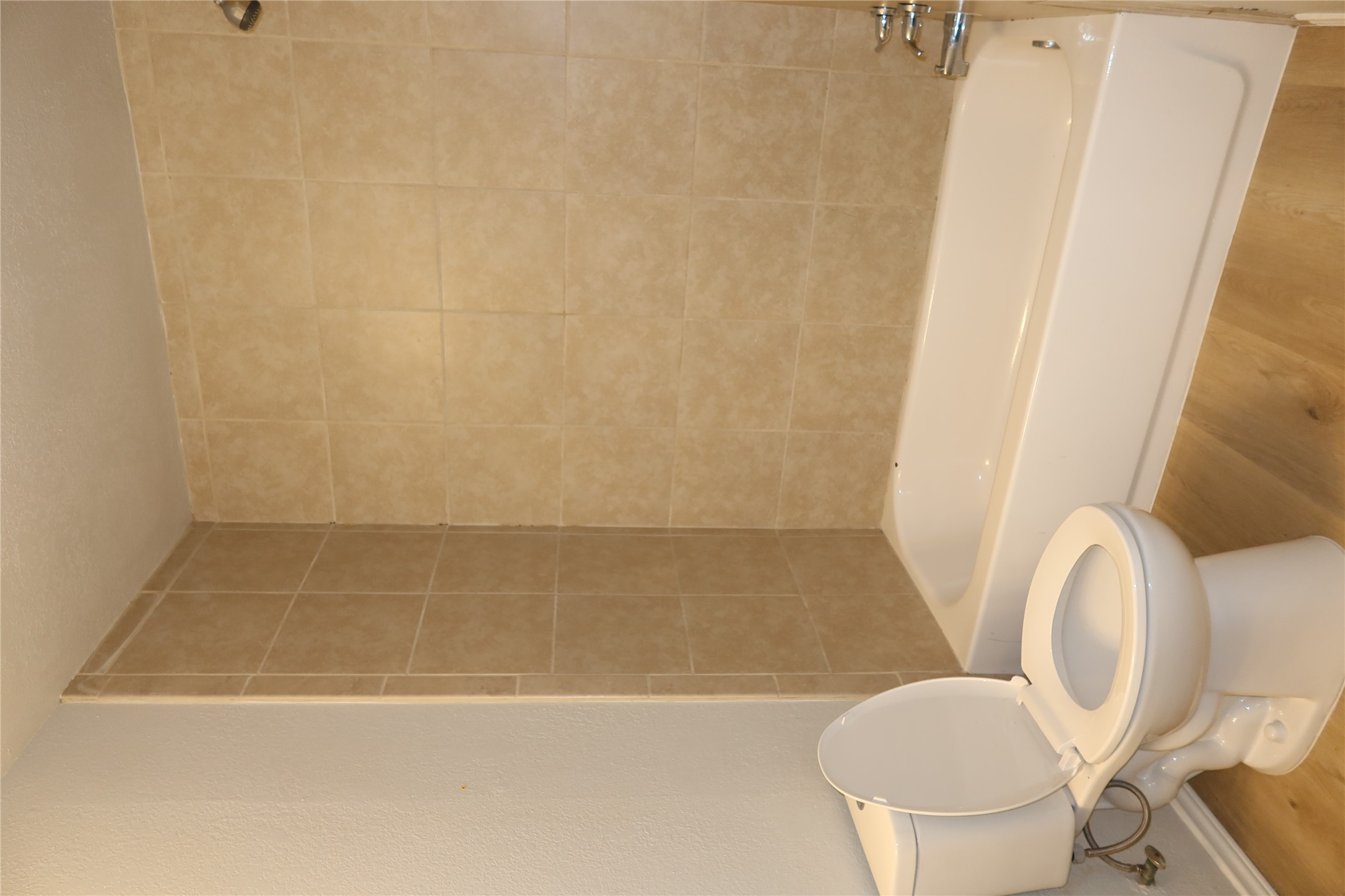 2511 Bucks Run, Unit A Austin, TX 78744 - Photo 15 of 25 Full bathroom with light wood-type flooring and washtub / shower combination
