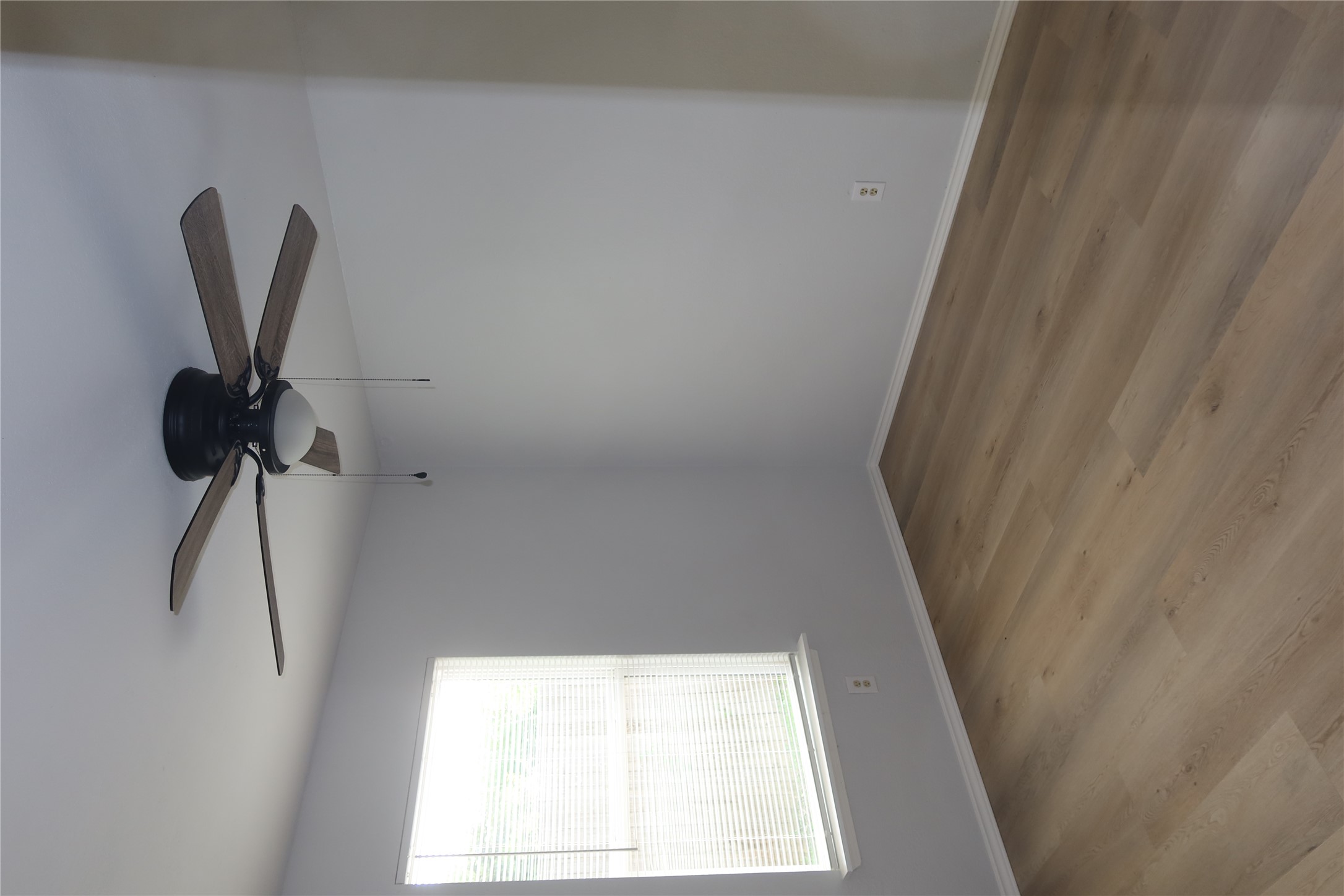 2511 Bucks Run, Unit A Austin, TX 78744 - Photo 17 of 25 Empty room with ceiling fan and wood finished floors