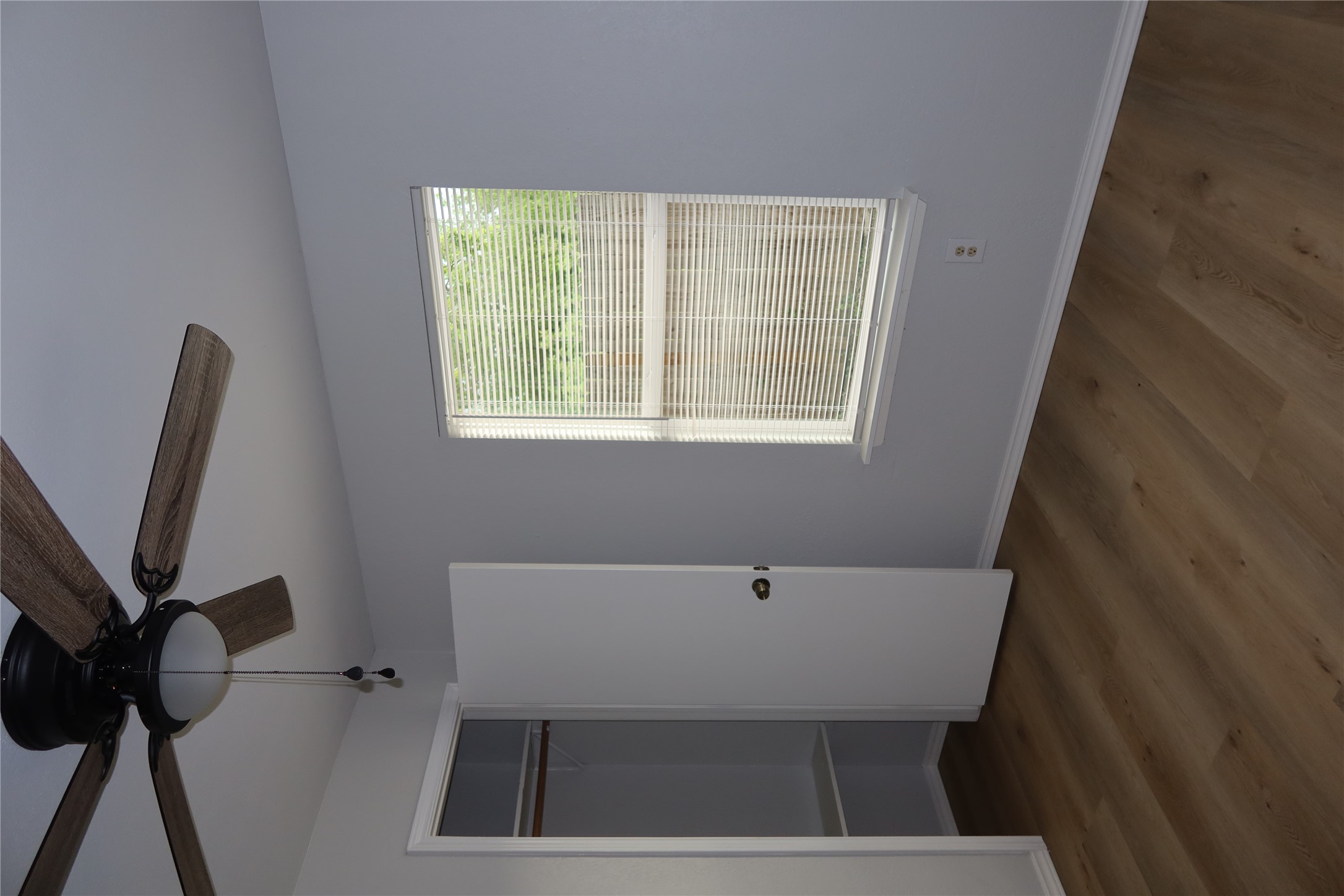 2511 Bucks Run, Unit A Austin, TX 78744 - Photo 18 of 25 Unfurnished bedroom with dark wood-style floors, a closet, and a ceiling fan