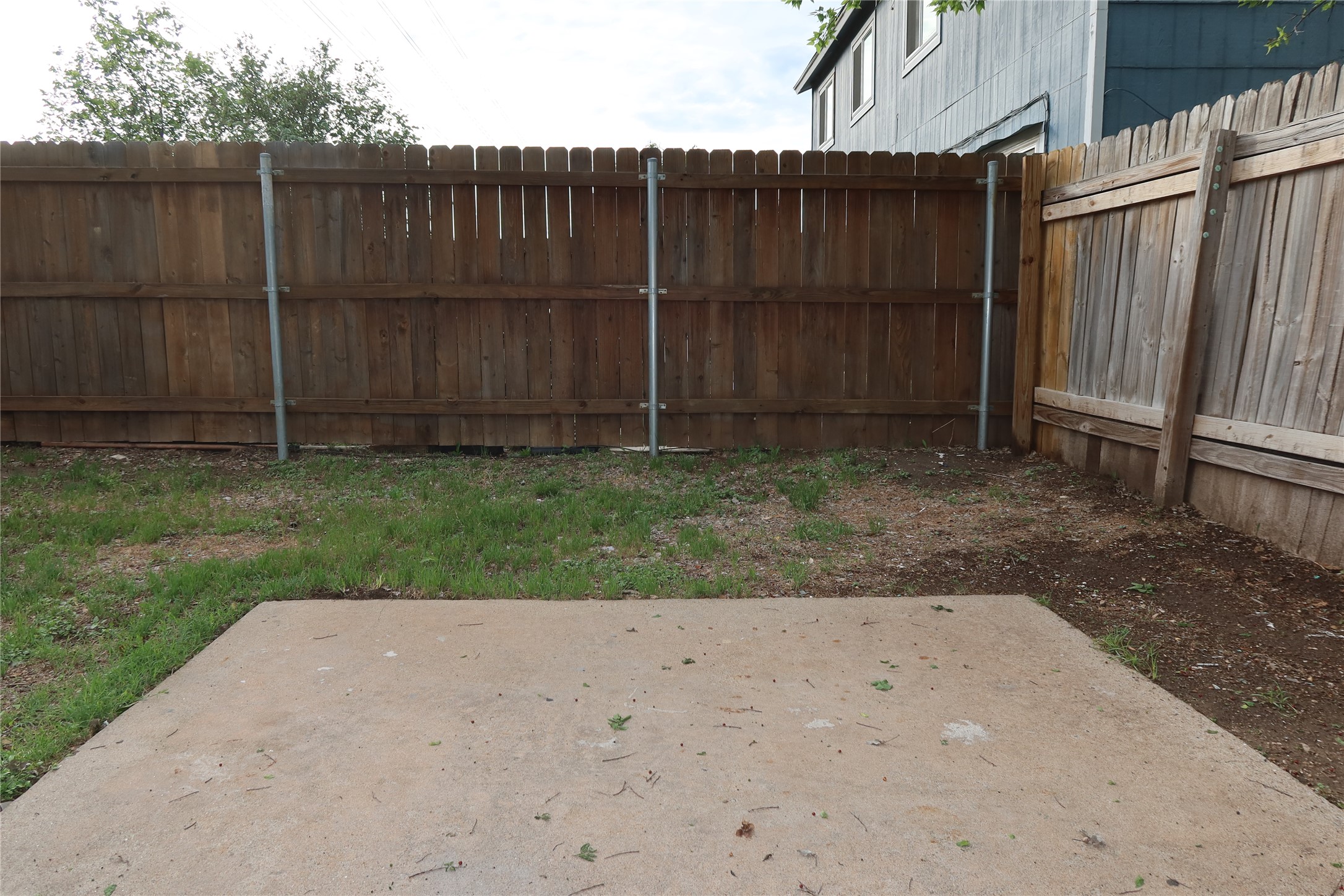 2511 Bucks Run, Unit A Austin, TX 78744 - Photo 20 of 25 Fenced yard featuring a patio area