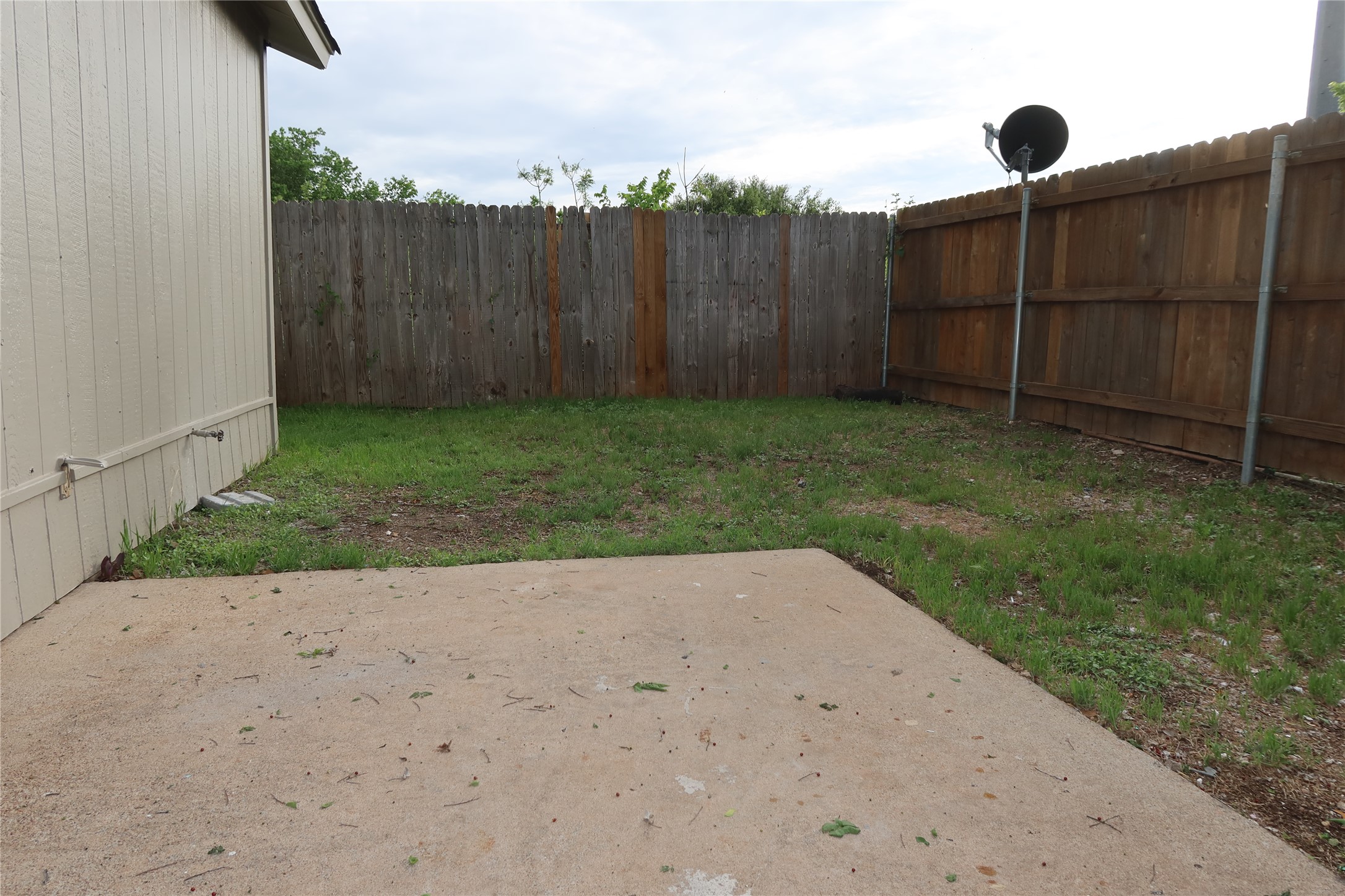 2511 Bucks Run, Unit A Austin, TX 78744 - Photo 21 of 25 Fenced backyard featuring a patio
