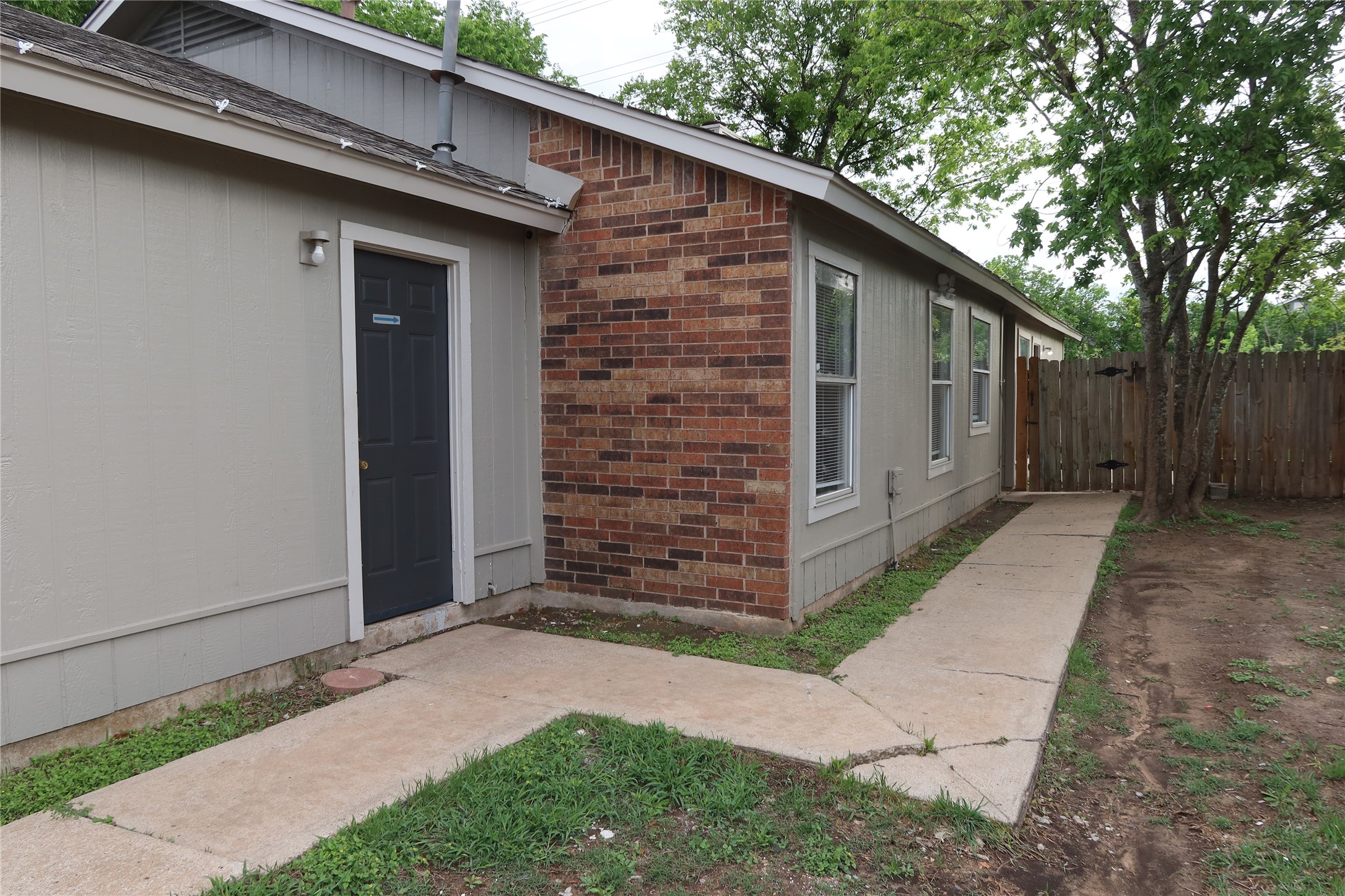 2511 Bucks Run, Unit A Austin, TX 78744 - Photo 24 of 25 View of exterior entry featuring brick siding