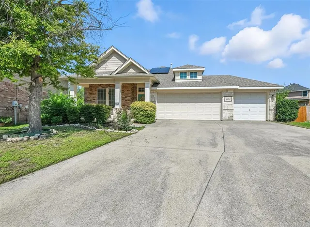 a front view of a house with yard