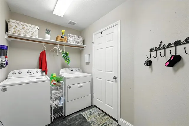 a bathroom with a sink vanity mirror and toilet