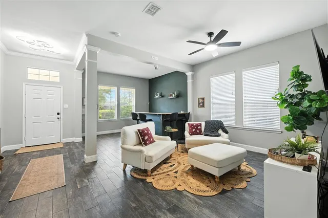 a living room with furniture and a large window