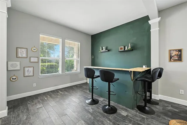 a workspace with furniture and a window