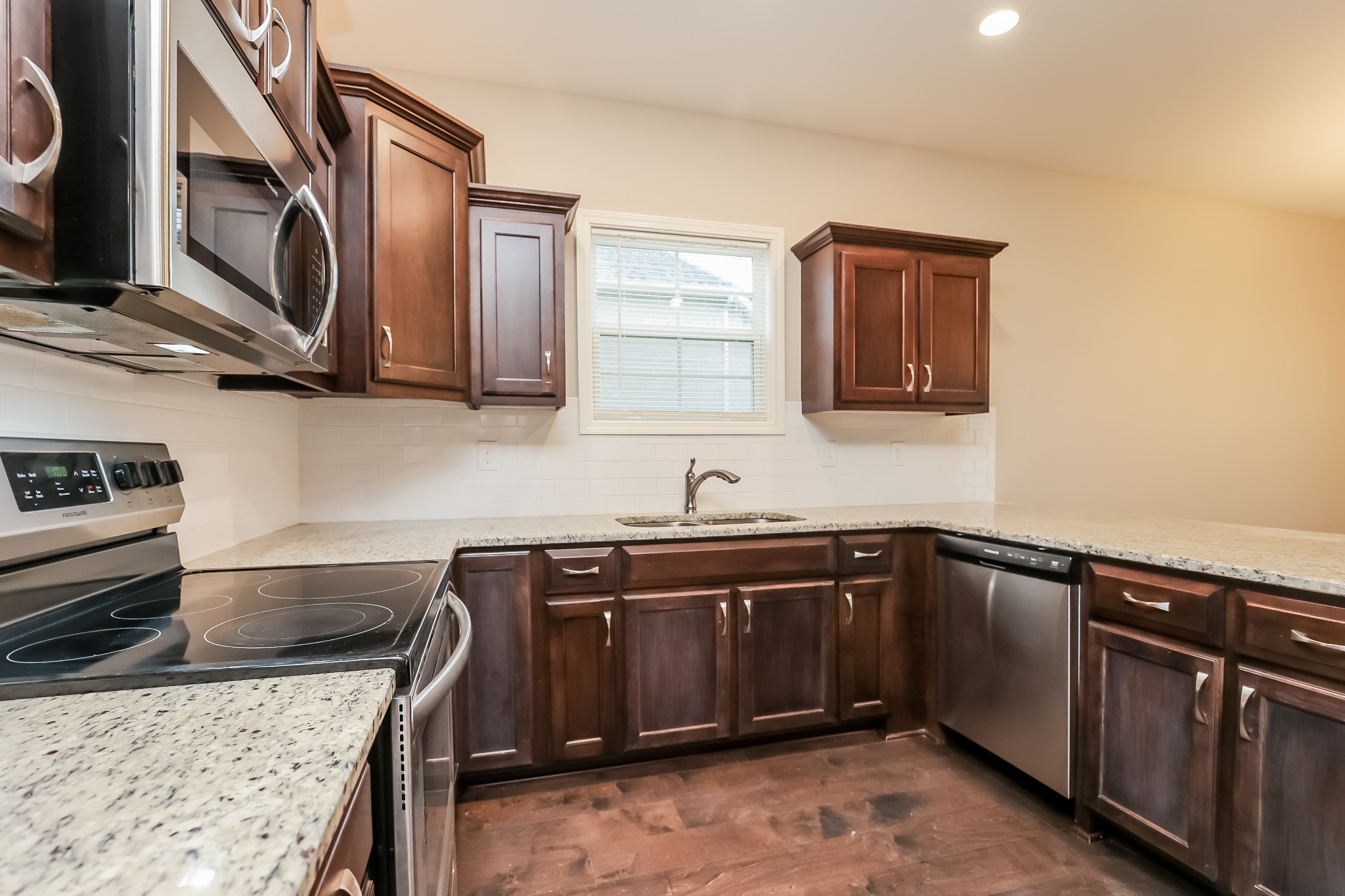 311 Bountiful Smyrna, TN 37167 - Photo 13 of 15 a kitchen with stainless steel appliances granite countertop a sink and a stove