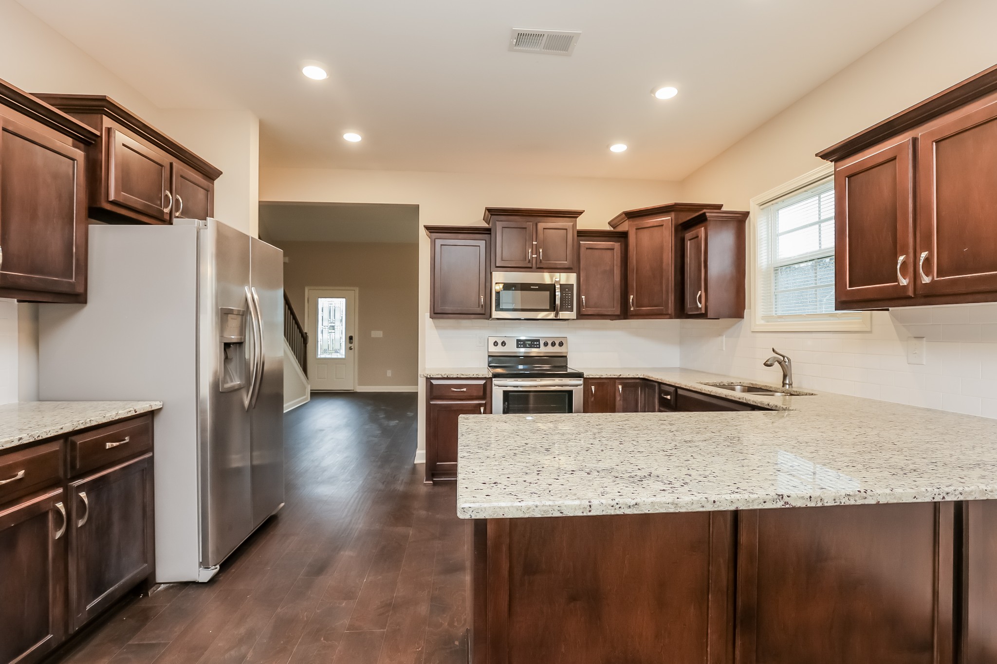 311 Bountiful Smyrna, TN 37167 - Photo 15 of 15 a kitchen with stainless steel appliances granite countertop a refrigerator a stove and a sink