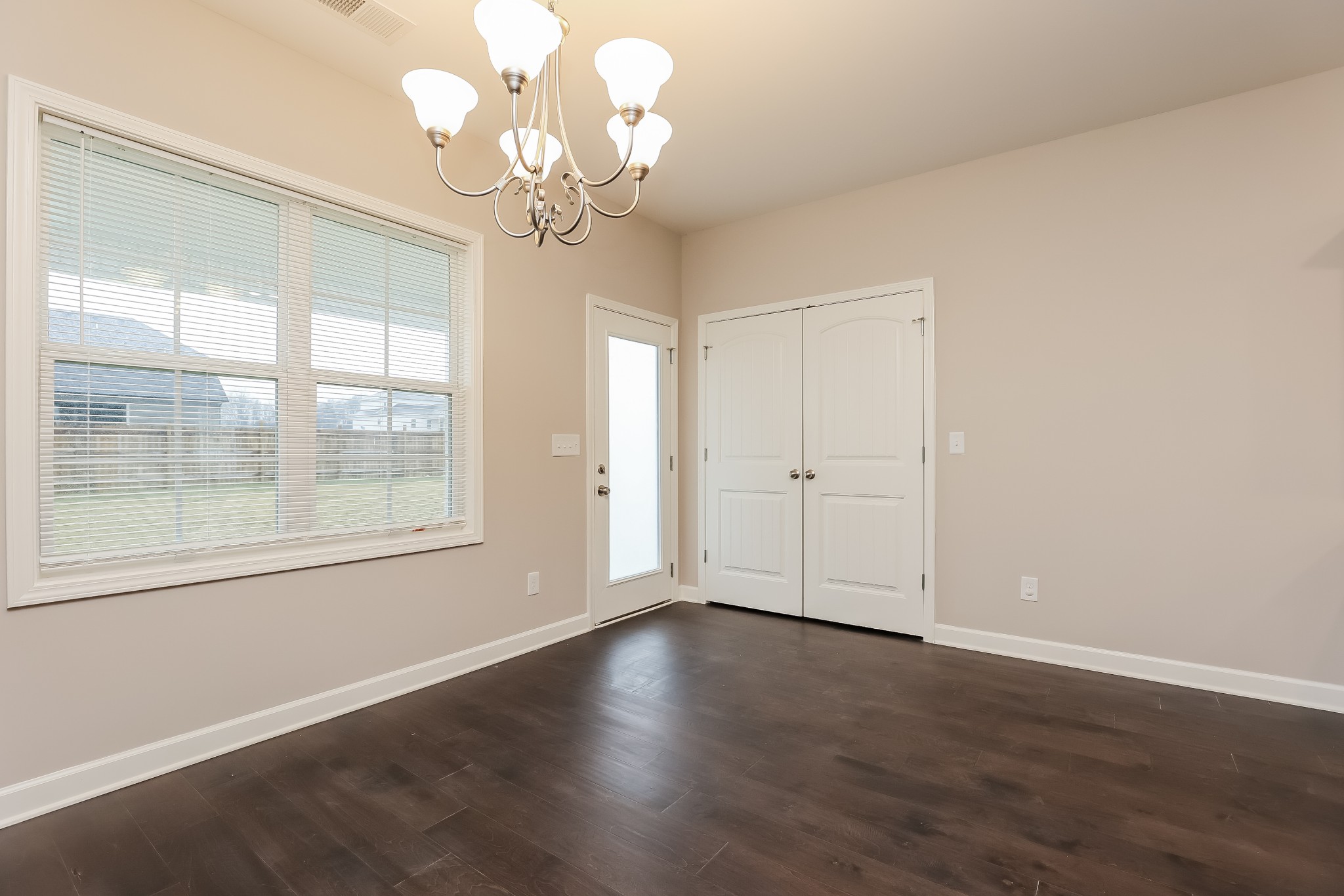 311 Bountiful Smyrna, TN 37167 - Photo 6 of 15 a view of an empty room with wooden floor and a window