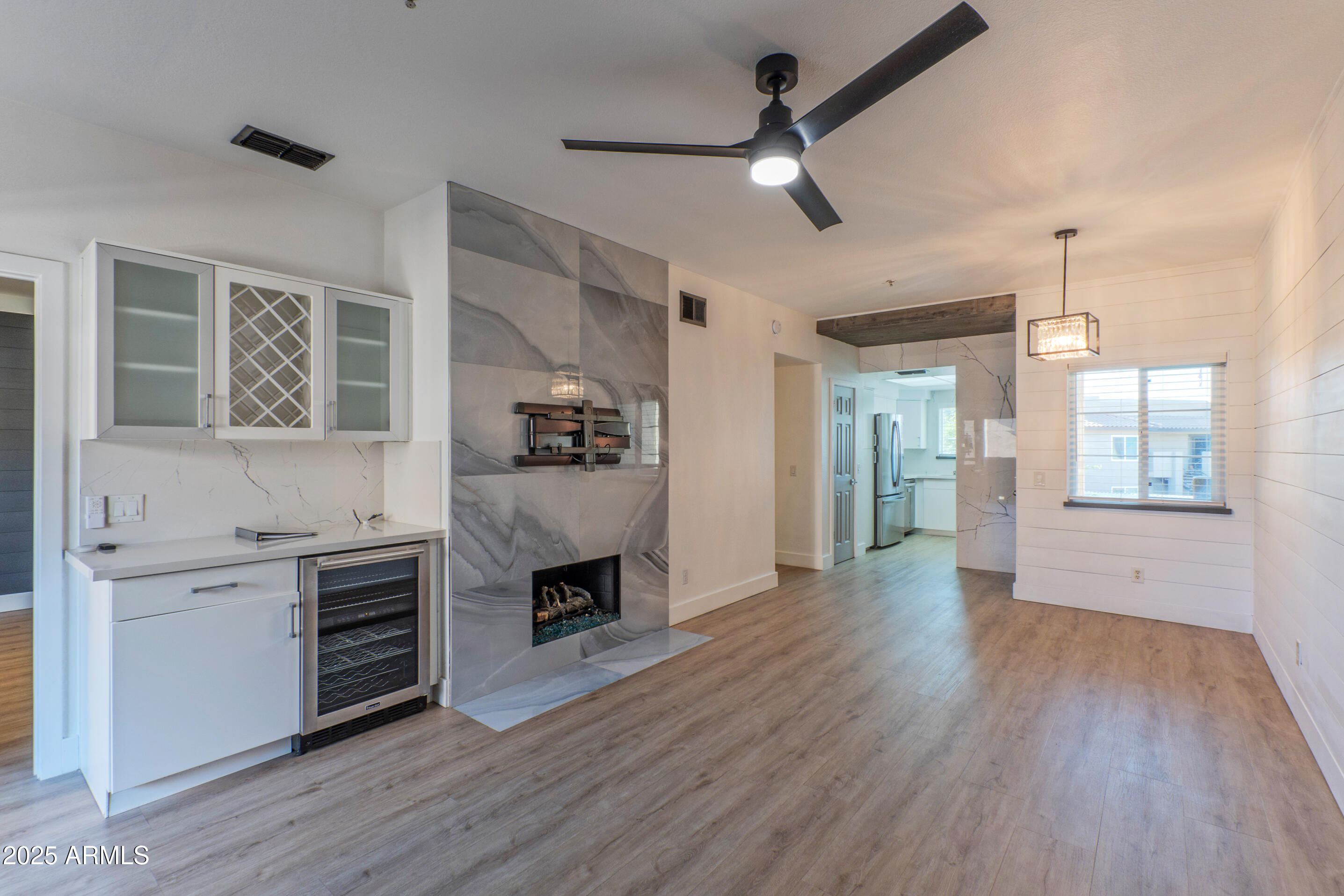 a open kitchen with cabinets a stove and a wooden floor