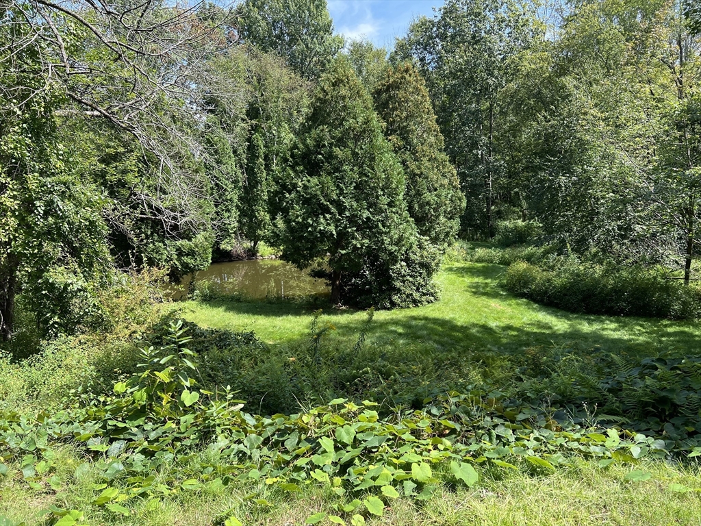 221 Pierce Road West Brookfield, MA 01585 - Photo 13 of 26 a view of a garden with a building