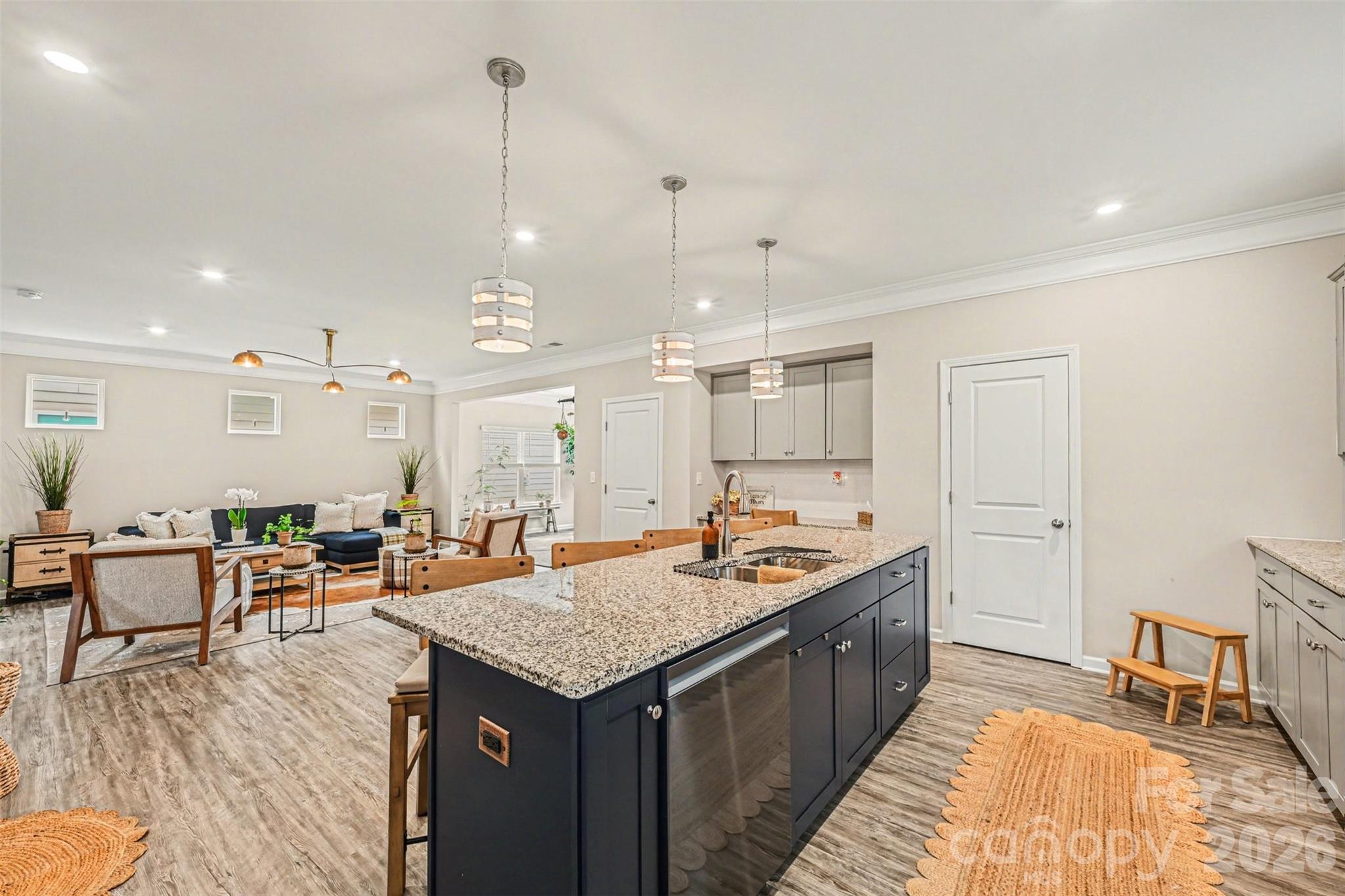 425 Kiser Lane Locust, NC 28097 - Photo 10 of 25 a kitchen that has a lot of cabinets a sink and wooden floor