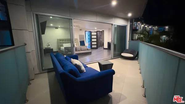 a bedroom with a bed and flat screen tv