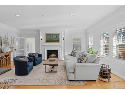 a living room with furniture window and a fireplace