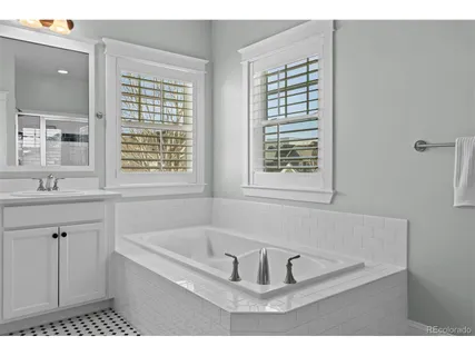 a bathroom with a shower and a glass door