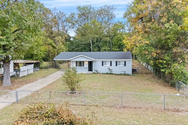a front view of a house with yard