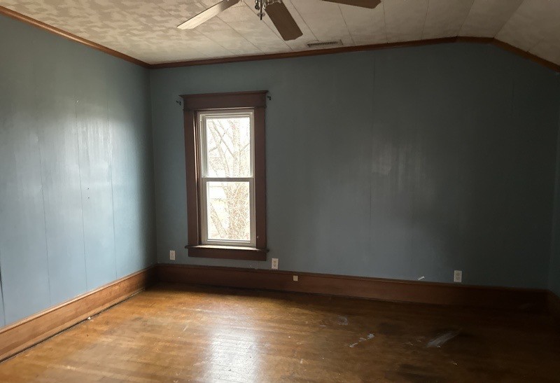 411 South Dean Street Royalton, IL 62983 - Photo 16 of 18 an empty room with wooden floor and windows