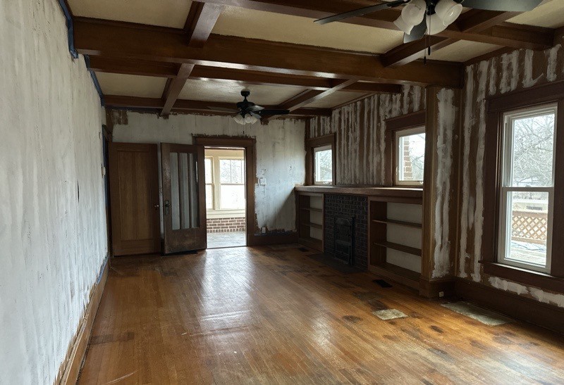 411 South Dean Street Royalton, IL 62983 - Photo 6 of 18 an empty room with wooden floor and windows